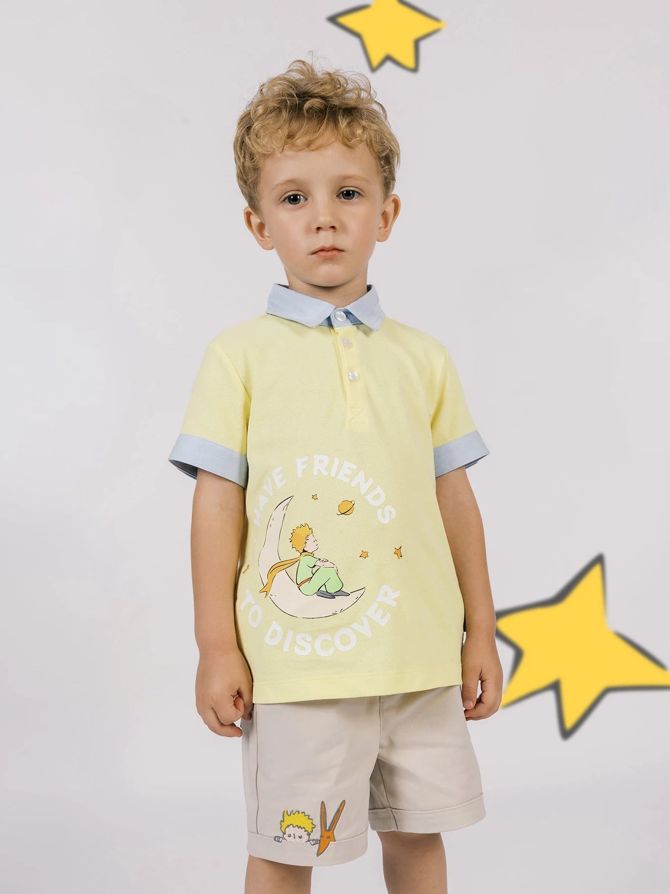A yellow character-print polo meets beige embroidered Bermuda shorts.