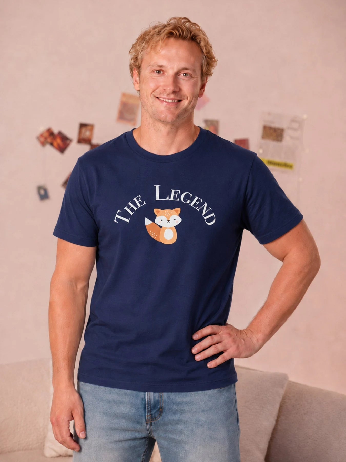 Adult wearing the navy The Legend fox graphic tee.