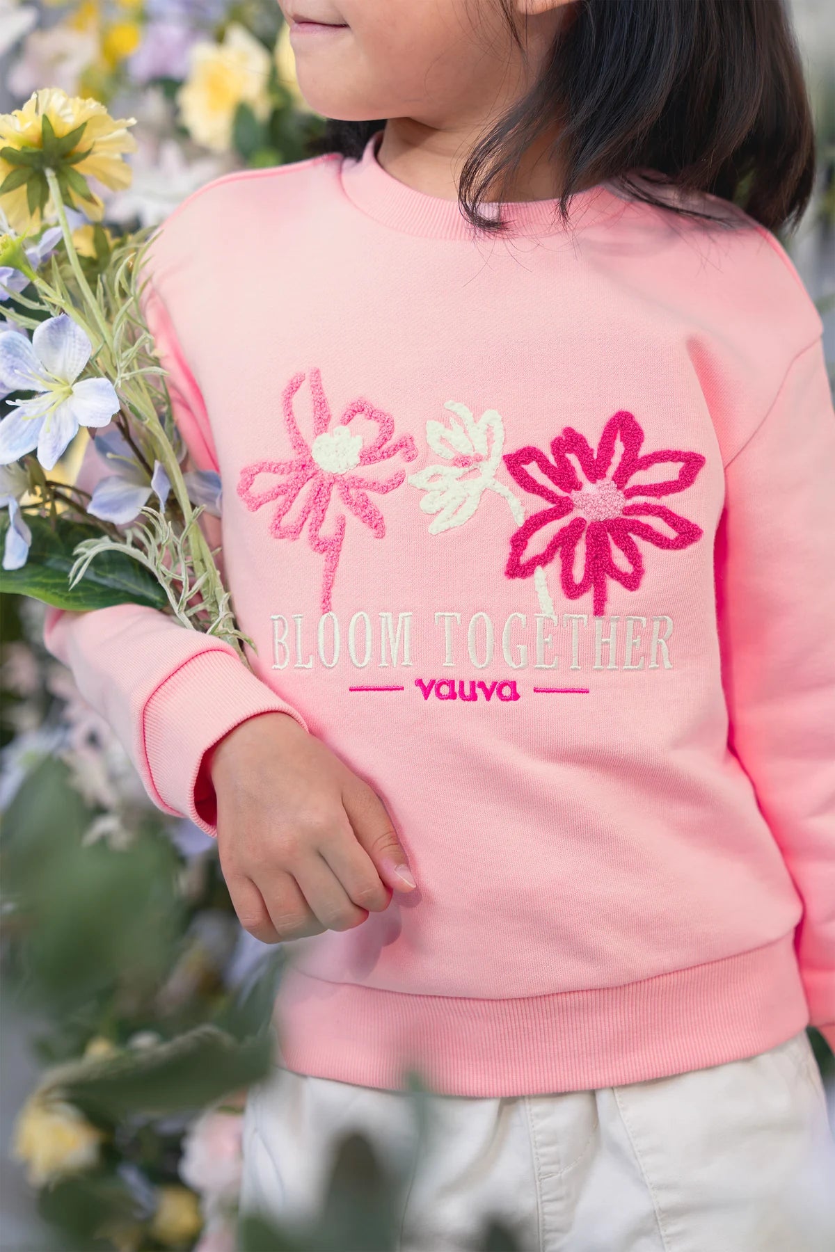 Embroidered flowers, seen up close.