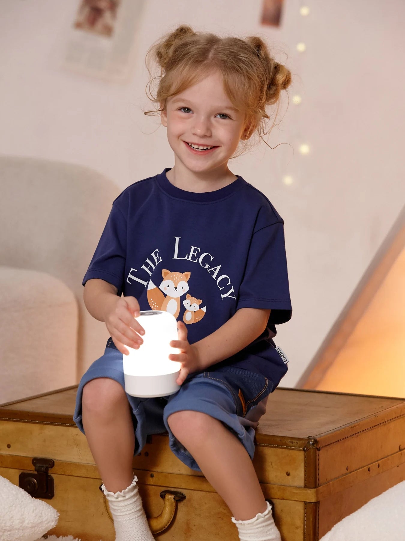 Child wearing the navy The Legacy fox graphic tee.
