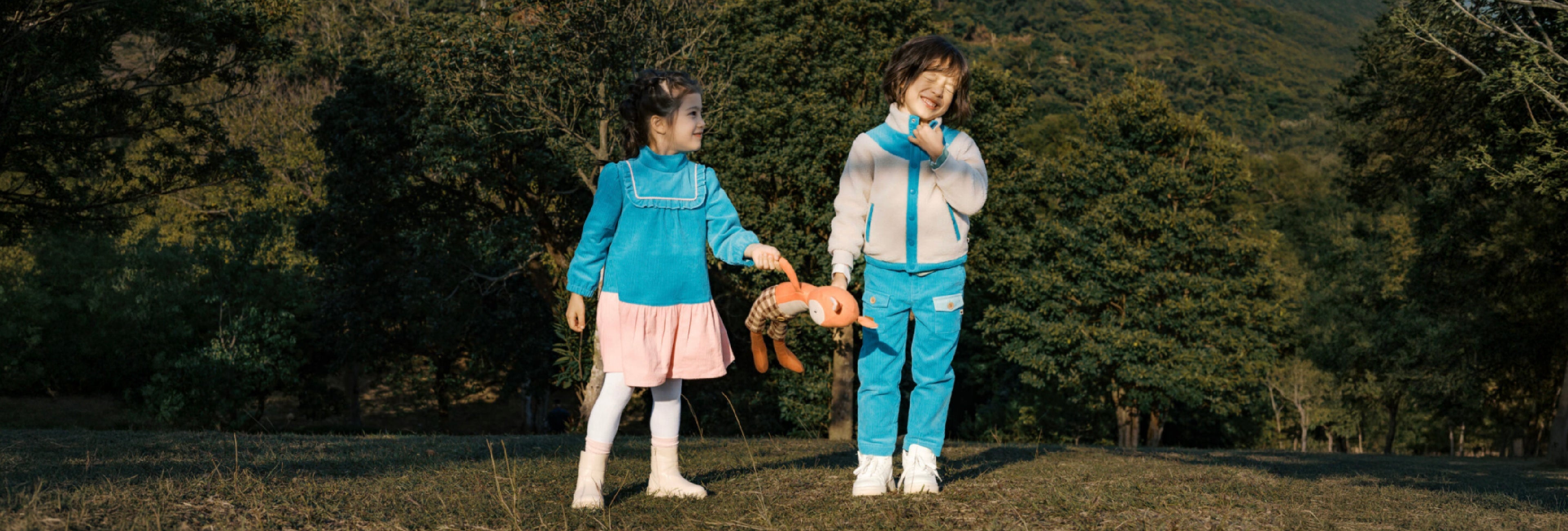 Two children exploring together outdoors