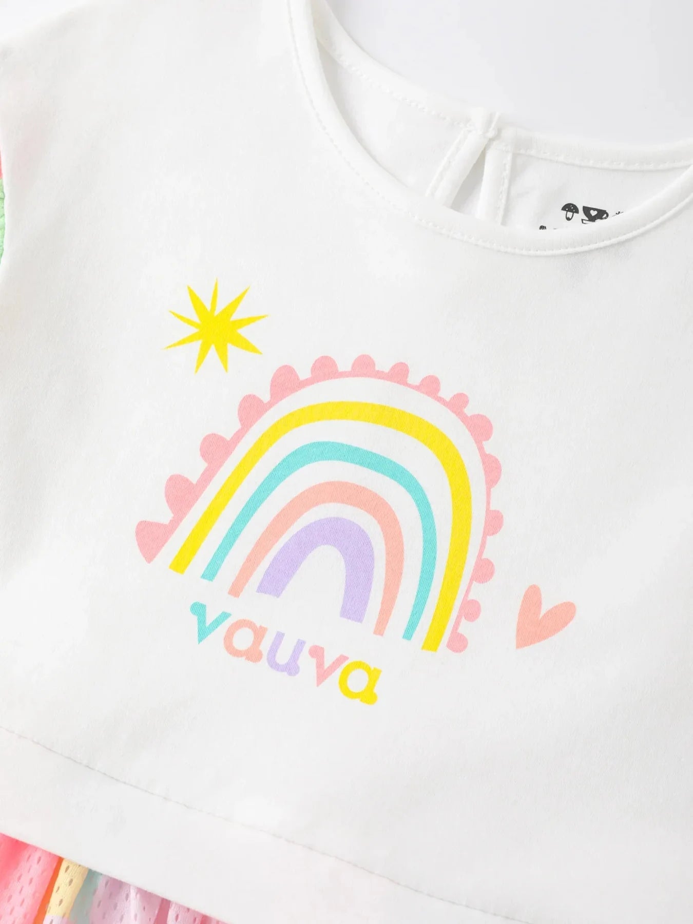 Rainbows and flowers in the dress print.