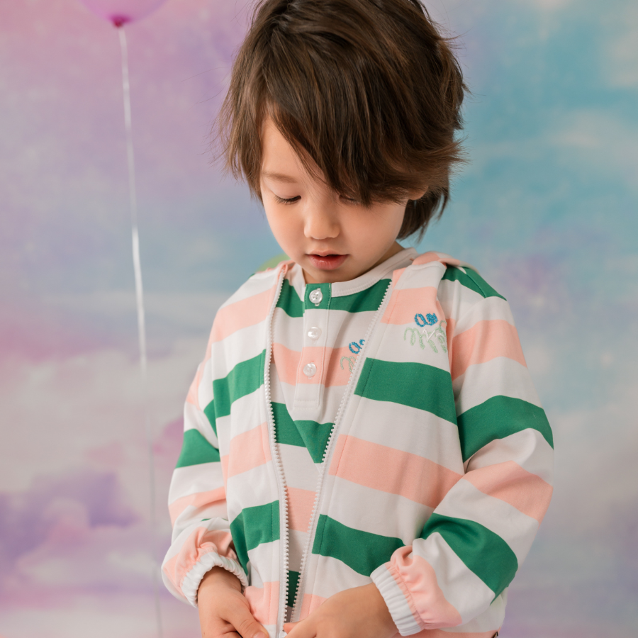 A child in a softly coloured Vauva striped top