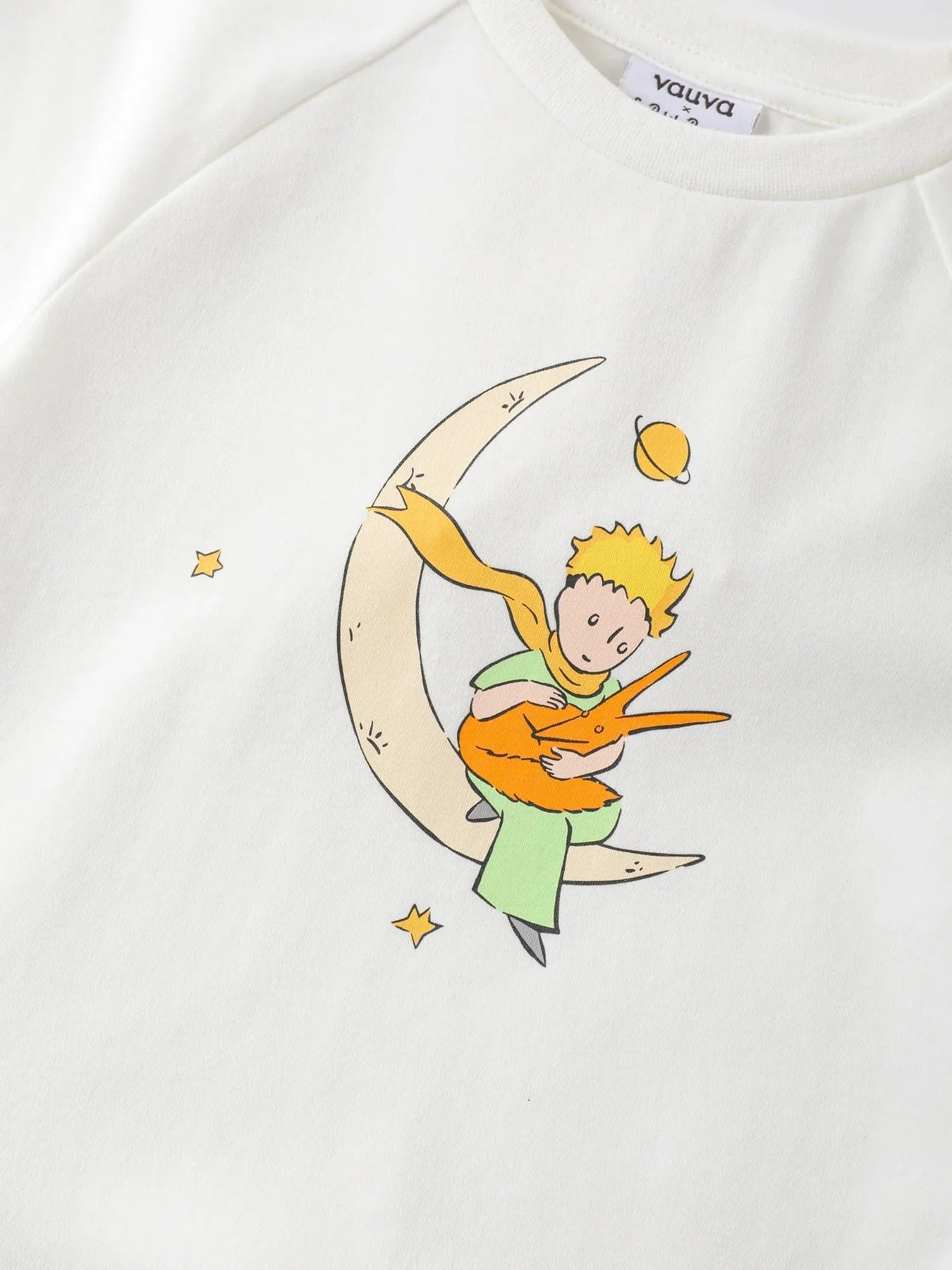 Close view of the Little Prince and fox artwork on the white two-tone dress.