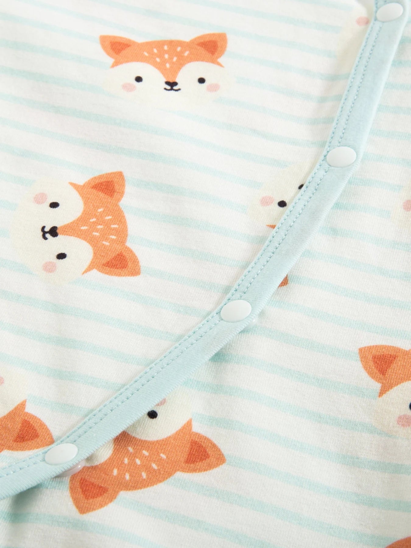 Wrap-front fastening on a fox-print romper