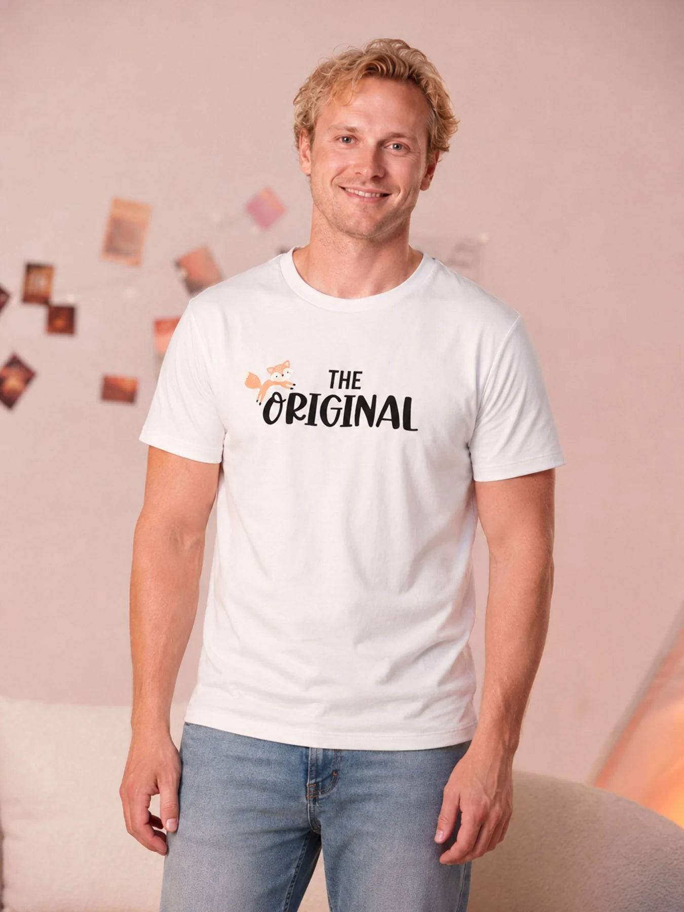 Adult wearing the white The Original graphic tee.